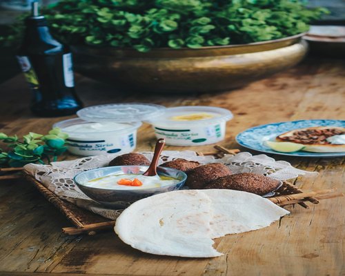 Traditional balanced meal platter with flatbread, lentils, and fresh yogurt